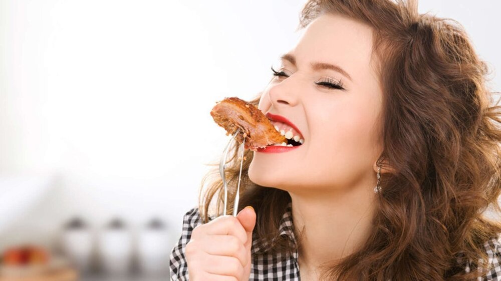 womanEatingPork.jpeg